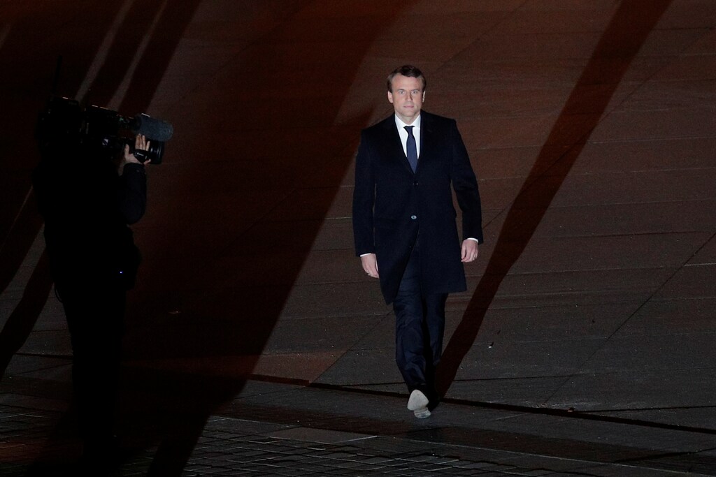 French President elect Emmanuel Macron walks towards the stage at the Pyramid du Louvre Museum to give a speech to supporters after results in the 2017 presidential election in Paris, France, May 7, 2017. REUTERS/Christophe Ena/Pool - RTS15KZE