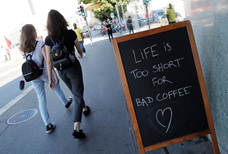A sign reads, "Life is too short for bad coffee", outside the Coffee Project in Lausanne, Switzerland, July 19, 2018.