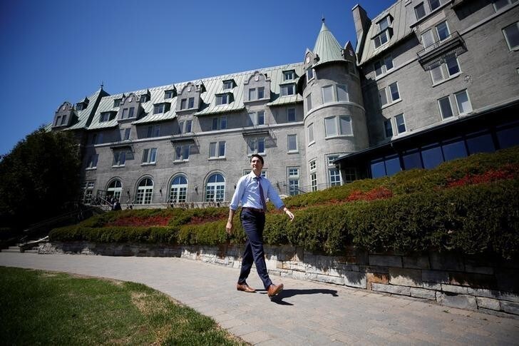 Canada's Prime Minister Justin Trudeau walks outside the Manoir Richelieu, site of the upcoming G7 leaders' summit in Quebec's Charlevoix region, before the start of an interview with Reuters in La Malbaie, Quebec, Canada, May 24, 2018. REUTERS/Chris Wattie