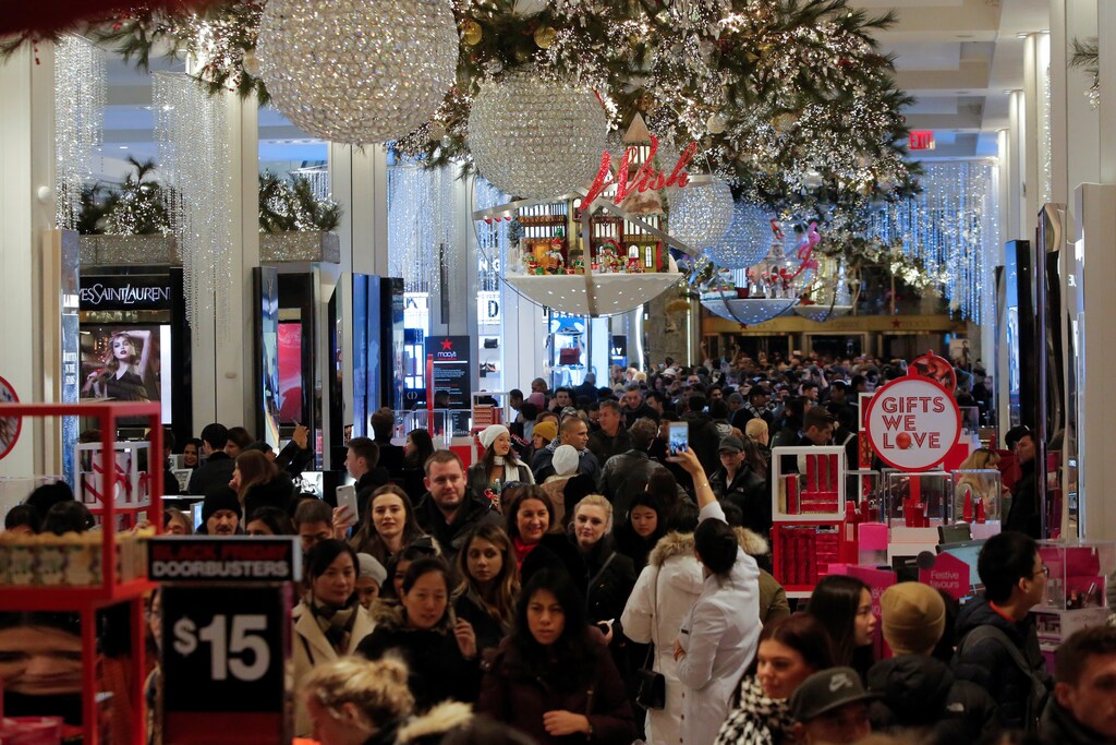 People walk through Macy's Herald Square during early opening for the Black Friday sales in Manhattan, New York, U.S., November 23, 2017. REUTERS/Andrew Kelly - RC1A20844B00