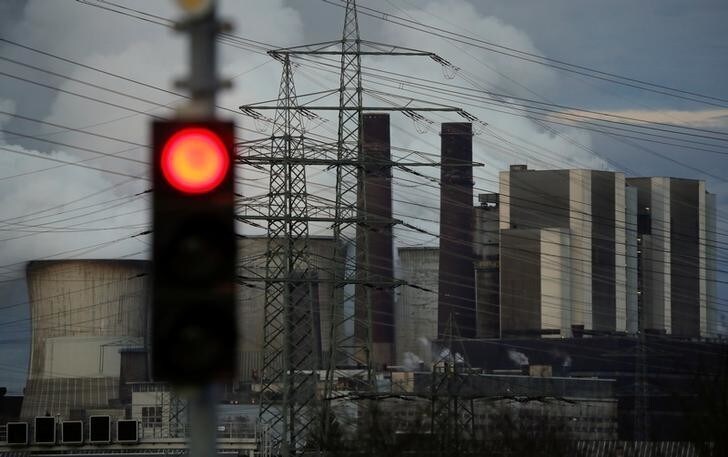 A traffic light signals red in front of the Weisweiler brown coal power plant of German energy supplier RWE, in Weisweiler near Aachen, Germany March 12, 2018. REUTERS/Wolfgang Rattay