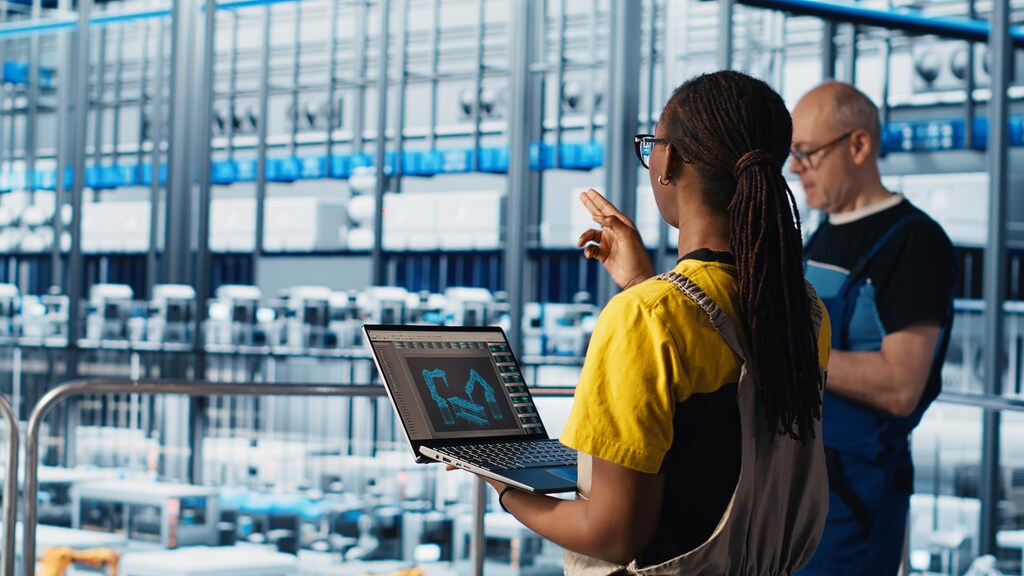 Engineering team working in smart factory, collecting and analyzing data. Caption: Software-Defined Automation (SDA) is fast becoming the foundation for the next era of industrial automation.