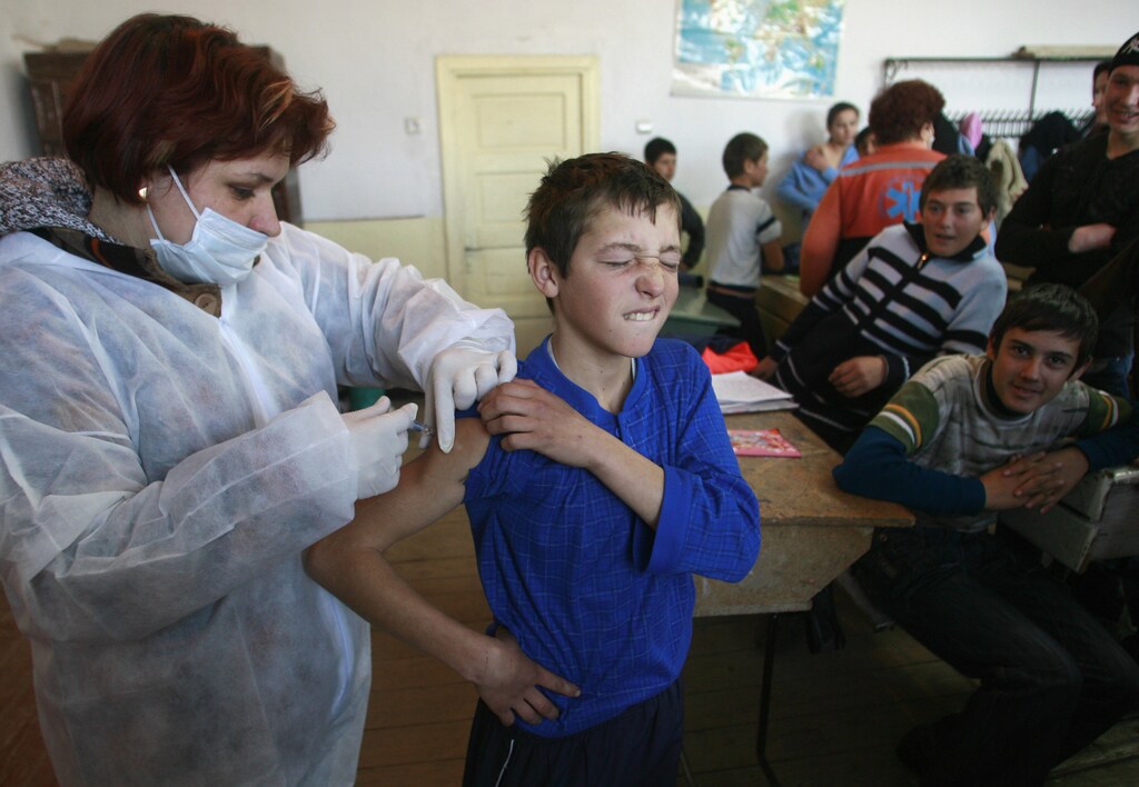 A Romanian child being vaccinated. REUTERS/Bogdan Cristel
