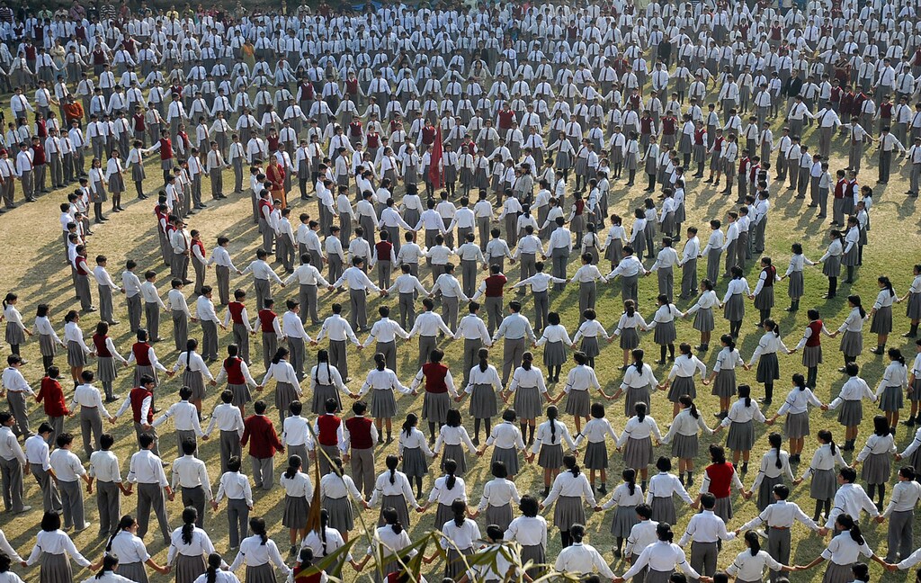 Students and teachers make a human chain inside the premises of their school to pay homage to the victims of Mumbai's recent attacks, in the northern Indian city of Lucknow December 5, 2008. Several attackers may have survived the three-day siege of Mumbai that killed 171 people last week, analysts said. REUTERS/Pawan Kumar (INDIA) - GM1E4C519XF01
