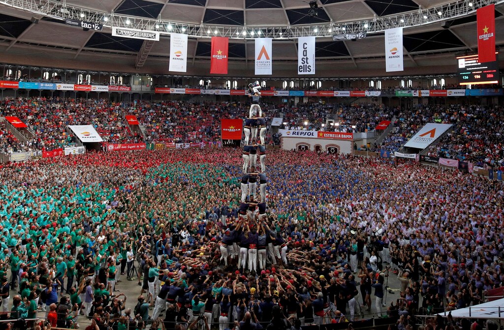 Group "Vella de Valls" form a human tower called "castell" during a biannual human tower competition.