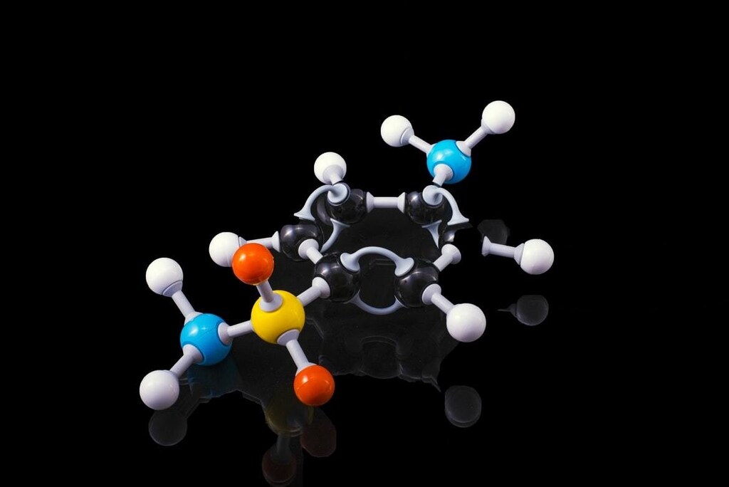 A molecule model with reflection on a dark surrounding.