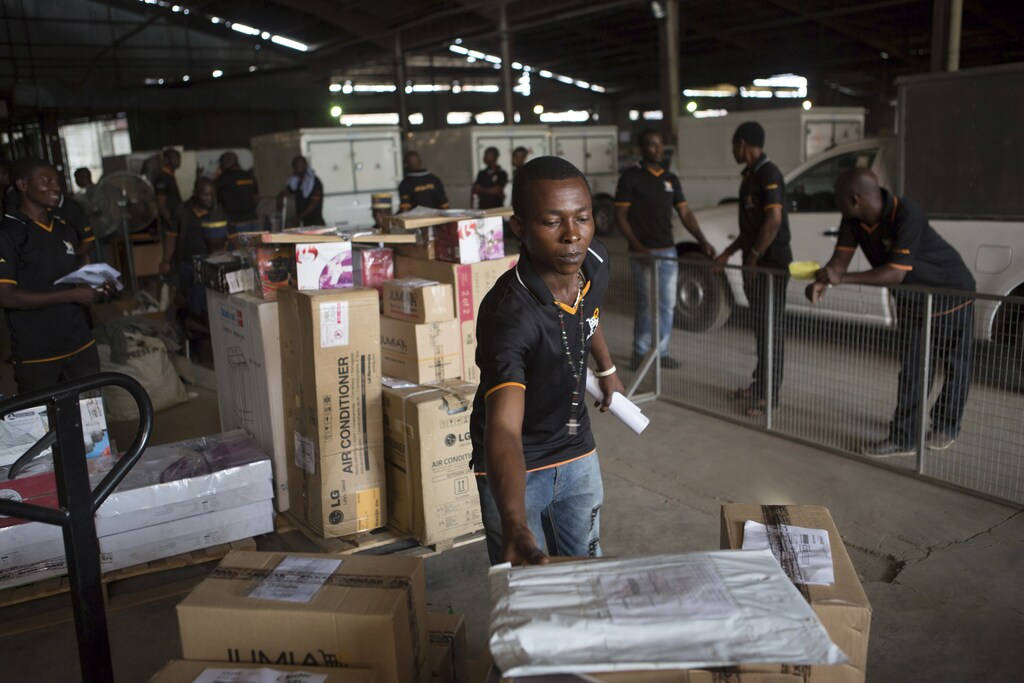 An employee of online retailer Jumia sorts packages for delivery at the company's warehouse in Lagos February 16, 2015. The growth of Africa's middle class has created demand for products that conventional retail struggles to satisfy due to a shortage of malls and grinding traffic in many cities that deters shoppers. The sector is still in its infancy. The internet's contribution to Africa's gross domestic product stood at 1.1 percent in 2013, much lower than other emerging markets. But this could rise to 10 percent, or $300 billion, by 2025, according to a report by consultants McKinsey's & Company. REUTERS/Joe Penney (NIGERIA - Tags: BUSINESS SOCIETY EMPLOYMENT) - GM1EB2G1R8301