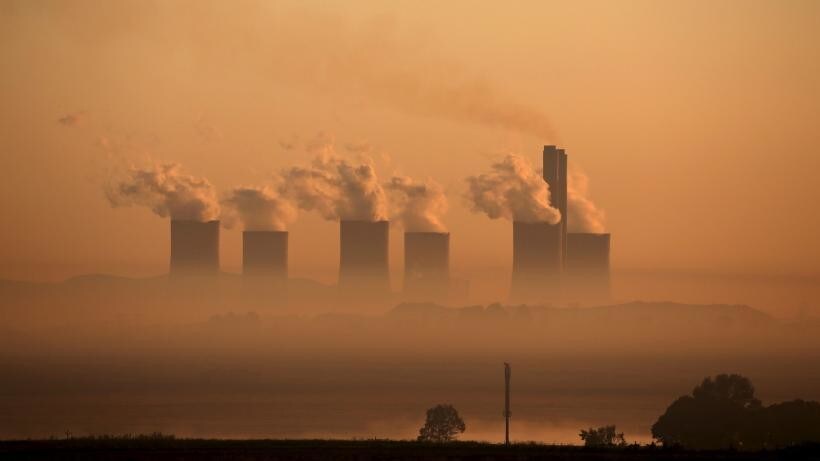 Steam rises at sunrise from the Lethabo Power Station, a coal-fired power station owned by state power utility Eskom near Sasolburg, South Africa,