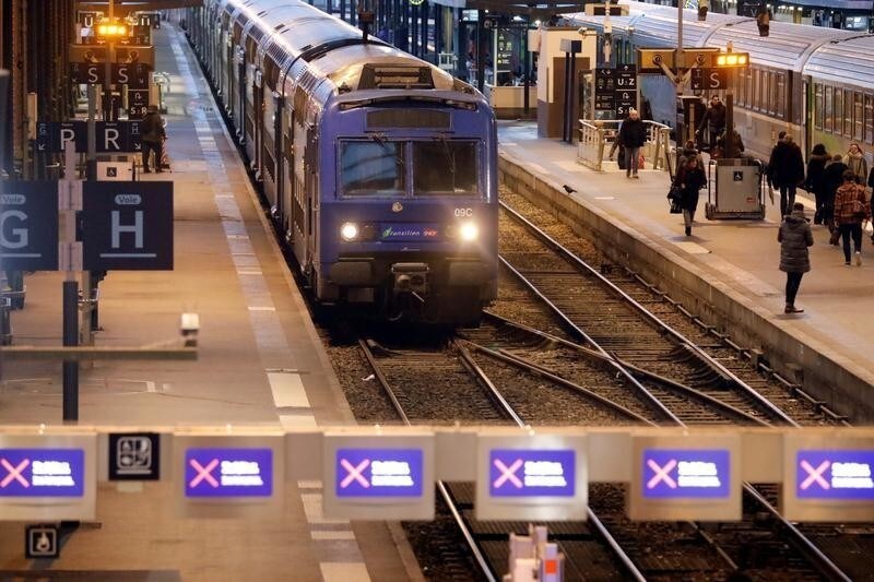 A Transilien train arrives at Gare de Lyon train station during a strike by all unions of French SNCF workers and the Paris transport network (RATP) in Paris as France faces its eighth day of consecutive strikes against French government's pensions reform plans, December 12, 2019. REUTERS/Charles Platiau - RC2TTD955TJ1