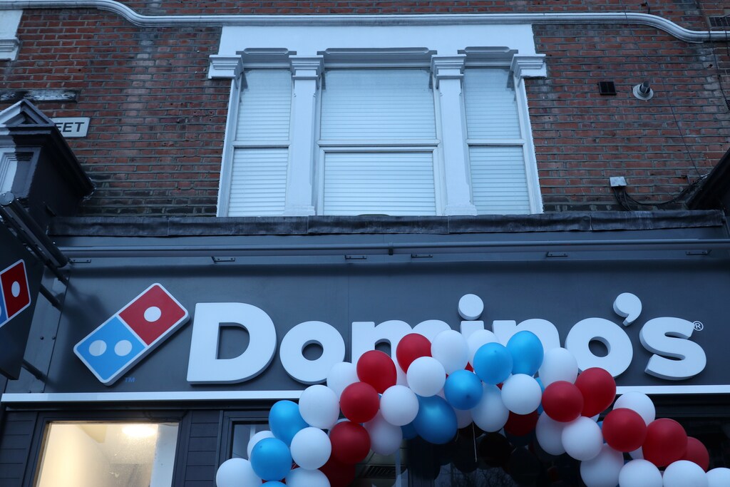 Balloons are seen on the front of a newly opened Domino's Pizza franchise in London, Britain, early morning March 14, 2017. REUTERS/Russell Boyce - RTX32J6Q