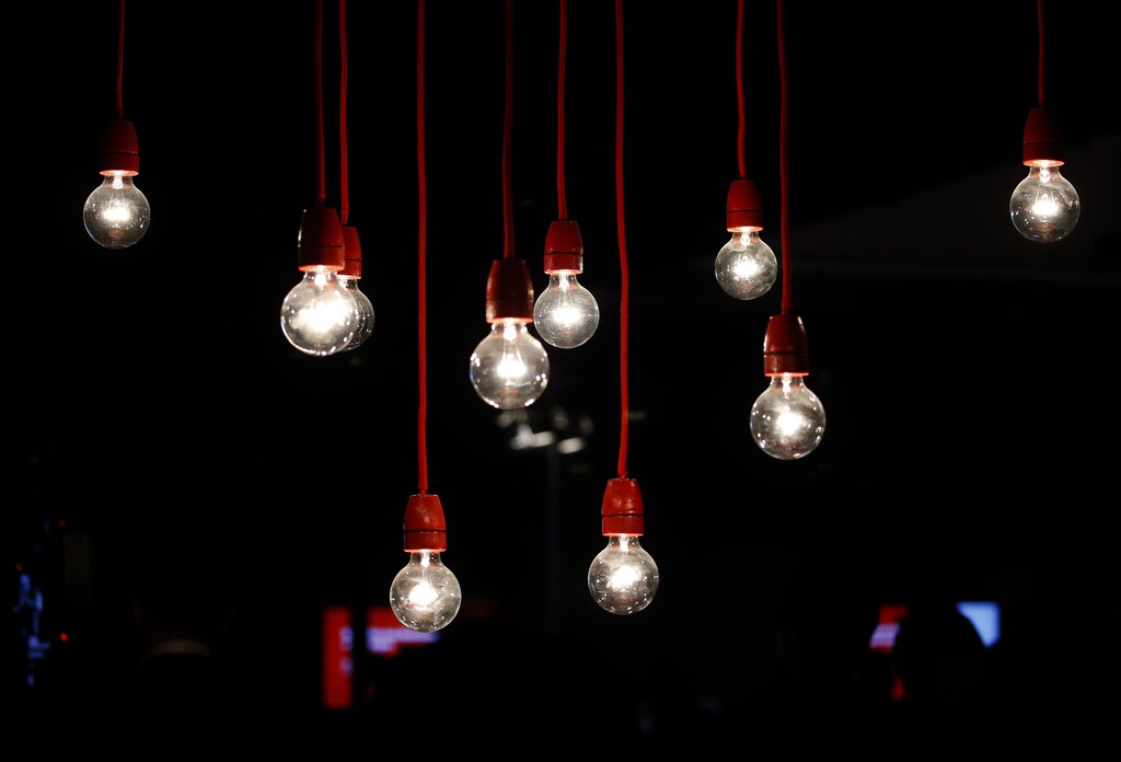 Lit lamps decorate the Vodafone stand at the CeBIT trade fair in Hanover March 15, 2015. The world's biggest computer and software fair will open to the public from March 16 to 20. REUTERS/Morris Mac Matzen (GERMANY - Tags: BUSINESS SCIENCE TECHNOLOGY BUSINESS TELECOMS TPX IMAGES OF THE DAY) - LR2EB3F0ZT0OH