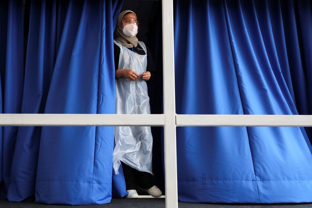 A medical worker looks out from a coronavirus disease (COVID-19) vaccination truck in Kuala Lumpur, Malaysia June 8, 2021.