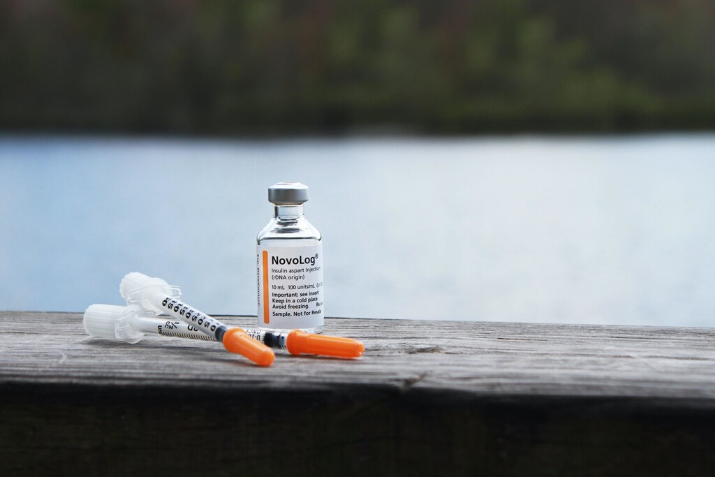 Insulin solution and syringe.
