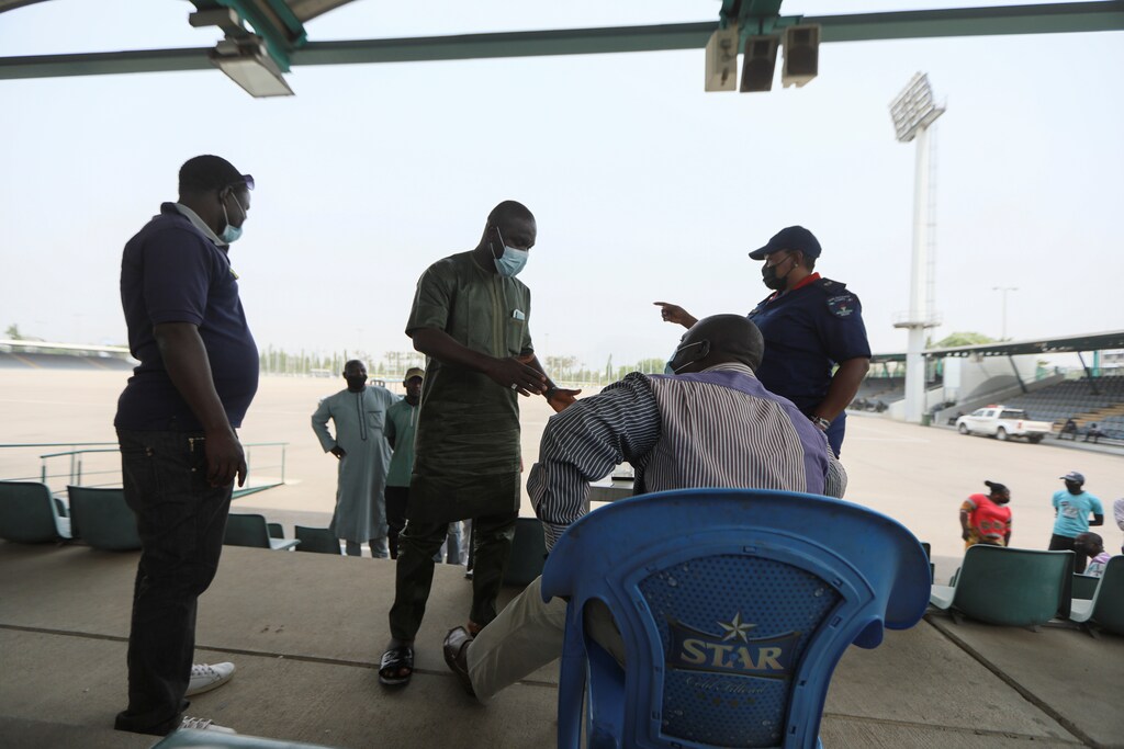 A COVID-19 rule breaker is seen during an interrogation at Eagle Square in Abuja, Nigeria February 23, 2021.