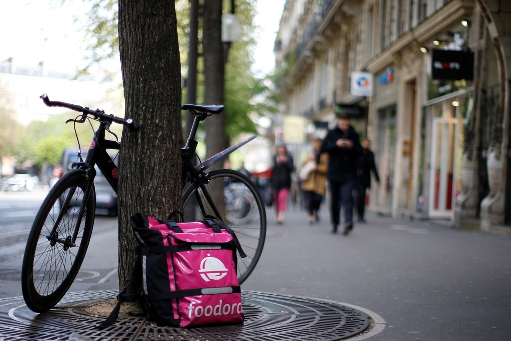A bicycle and a delivery bag with the logo of Foodora, a Berlin-based online food delivery company, part of the emerging 'gig economy' is seen in Paris, France, April 6, 2017. Picture taken April 6, 2017. REUTERS/Gonzalo Fuentes - RC166096A2C0