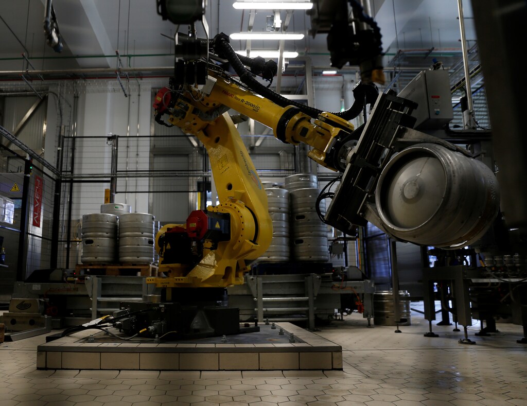 A robotic arm handles beer kegs at the keg plant at Farsons Brewery in Mriehel, Malta June 4, 2018. Picture taken June 4, 2018. REUTERS/Darrin Zammit Lupi - RC162A41E110