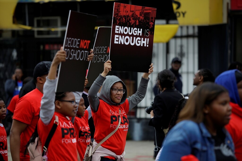 Pastor John Hannah of New Life Covenant Church leads a march and pray for our lives against gun violence in Chicago, Illinois, U.S., May 19, 2018. REUTERS/Joshua Lott - RC13A36C4A70