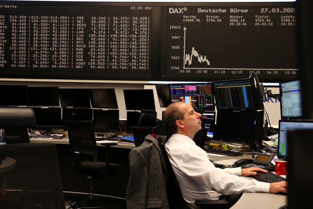 A stock broker works at Frankfurt's stock exchange as markets react on the coronavirus disease (COVID-19), at the stock exchange in Frankfurt, Germany, March 27, 2020 Coronavirus china virus health healthcare who world health organization disease deaths pandemic epidemic worries concerns Health virus contagious contagion viruses diseases disease lab laboratory doctor health dr nurse medical medicine drugs vaccines vaccinations inoculations technology testing test medicinal biotechnology biotech biology chemistry physics microscope research influenza flu cold common cold bug risk symptomes respiratory china iran italy europe asia america south america north washing hands wash hands coughs sneezes spread spreading precaution precautions health warning covid 19 cov SARS 2019ncov wuhan sarscow wuhanpneumonia pneumonia outbreak patients unhealthy fatality mortality elderly old elder age serious death deathly deadly