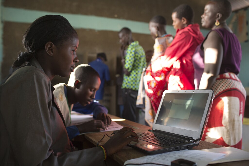 An Independent Electoral and Boundaries Commission (IEBC) official saves digital data after having scanned a voter's fingerprint with a biometric identification system during the Kenyan general elections at the Lorubae primary school in Archers Post, Isiolo County in northern Kenya, March 4, 2013. Polling stations opened up to Kenyans on Monday for a tense presidential election that will test whether the east African nation can repair its damaged reputation after the tribal blood-letting that followed a 2007 poll. REUTERS/Siegfried Modola (KENYA - Tags: POLITICS ELECTIONS) - RTR3EJPQ