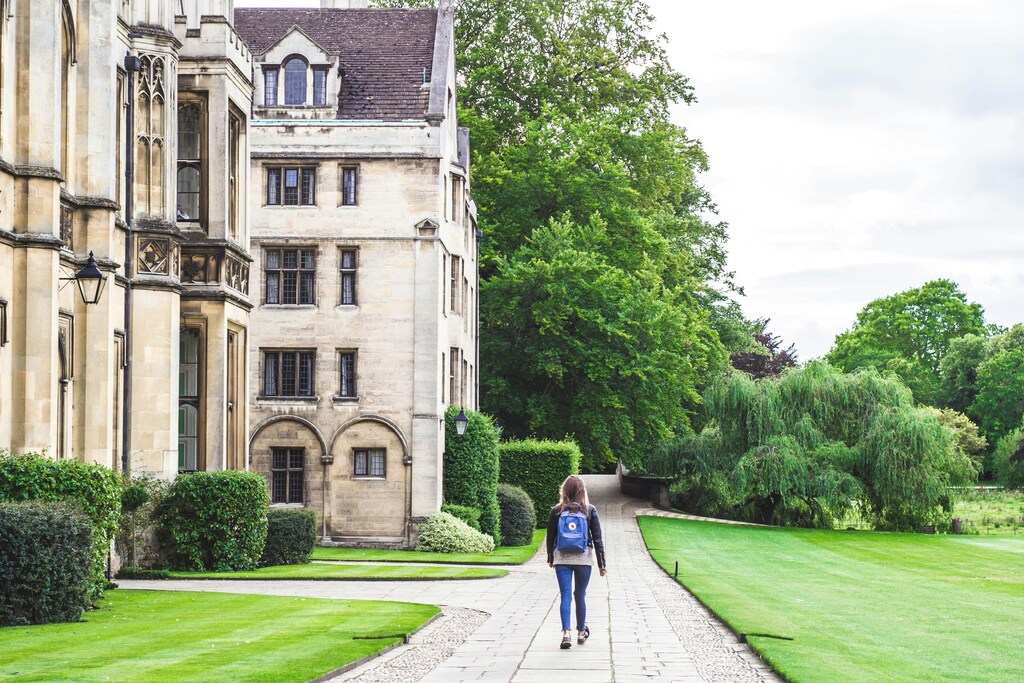 A student with backpack walks in front of King's College in Cambridge: The United Kingdom has three of the world's top most internationally-connected universities according to Times Higher Education.