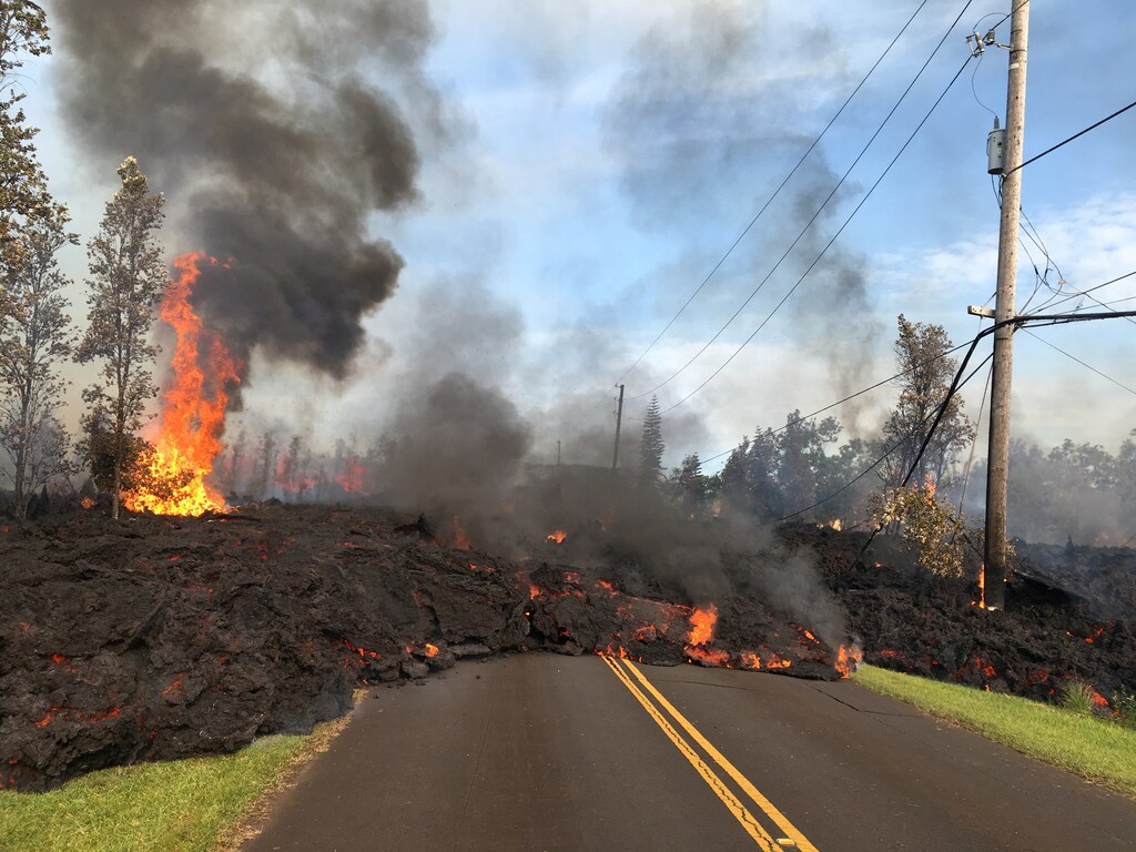 Lava advances along a street near a fissure in Leilani Estates, on Kilauea Volcano's lower East Rift Zone, Hawaii, the U.S., May 5, 2018. U.S. Geological Survey/Handout via REUTERS THIS IMAGE HAS BEEN SUPPLIED BY A THIRD PARTY. IT IS DISTRIBUTED, EXACTLY AS RECEIVED BY REUTERS, AS A SERVICE TO CLIENTS TPX IMAGES OF THE DAY - RC1C24B41D60