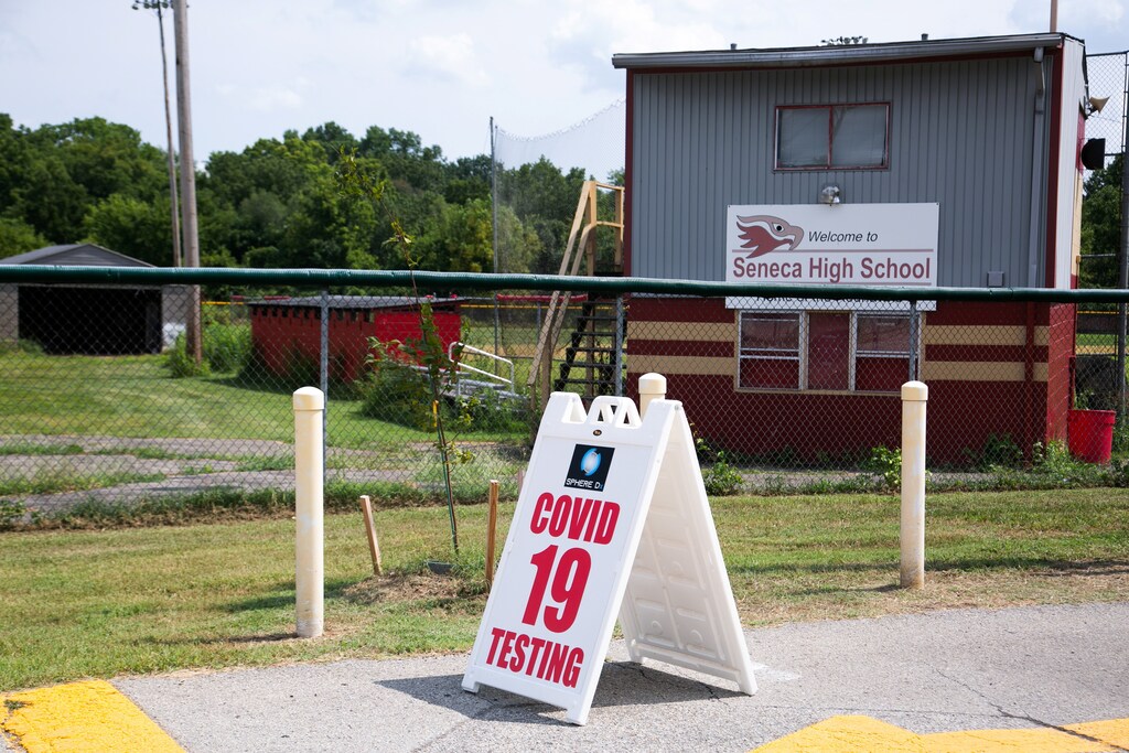 A coronavirus disease (COVID-19) testing sign is seen in front of Seneca High School, a day before returning to school in Louisville, Kentucky, U.S., August 10, 2021. REUTERS/Amira Karaoud - RC2E2P9XT4DU