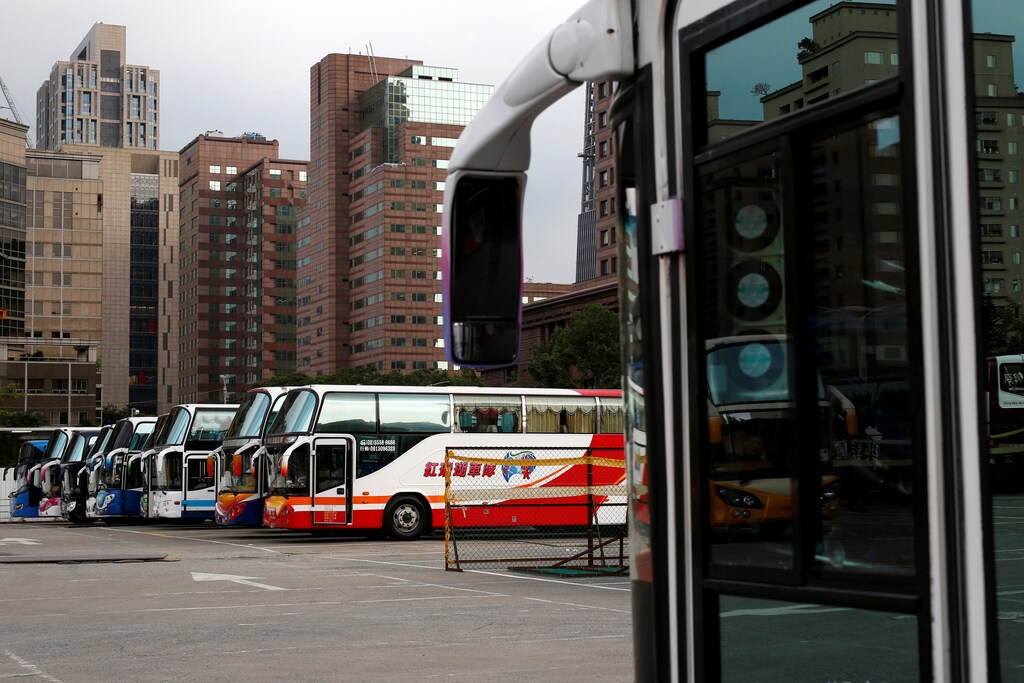 Tourist buses are parked in a row at the parking lot in Taipei, Taiwan May 6, 2016. REUTERS/Tyrone Siu - S1BETDJDFGAF