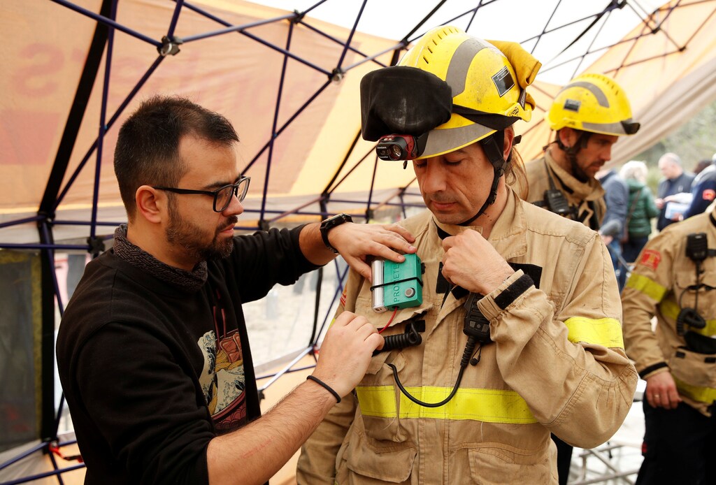 A Prometeo monitoring device (by IBM) is attached to firefighter's suit during prescribed burn of the forest in Olivella, south of Barcelona, Spain February 11, 2020. Picture taken February 11, 2020. REUTERS/Albert Gea ? - RC2H8F9G8IVJ