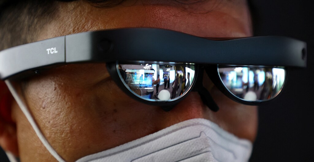 A person wears an upgraded TCL NXTWEAR S wearable display glasses at the booth of Chinese brands TCL at the Internationale Funkausstellung IFA consumer technology fair, in Berlin, Germany September 1, 2022. Spatial computing is going to fundamentally change how we use and interact with AI.