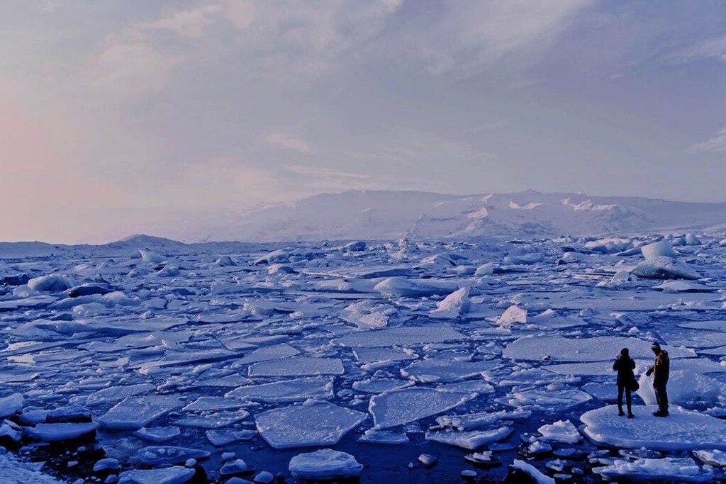 image of people watching breaking ice sheets