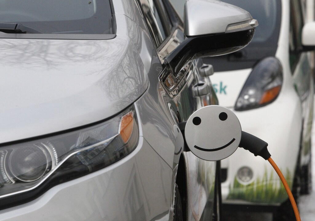An electric car is charged during a demonstration ceremony to launch a charging station owned by the Moscow United Electric Grid Company (MOESK), in Moscow February 28, 2012.