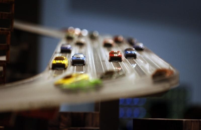 Miniature cars move along the elevated freeway at Chris Burden's large-scale kinetic sculpture, Metropolis II, during the media preview at the Los Angeles County Museum of Art (LACMA) in Los Angeles, California January 11, 2012. The sculpture, modeled after a fast-paced futuristic city with 1,100 miniature cars running through an elaborate system of roadway tracks at a scale speed of about 240 miles per hour (386 kph), is meant to evoke the energy of a city. The exhibit opens to the public January 14. REUTERS/David McNew (UNITED STATES - Tags: TRANSPORT SOCIETY) - RTR2W60M