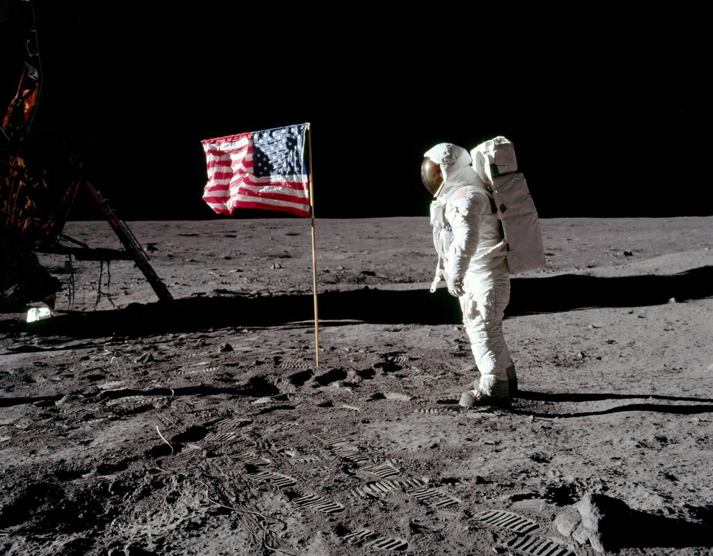 Astronaut Buzz Aldrin, lunar module pilot for Apollo 11, poses for a photograph beside the deployed United States flag during an extravehicular activity (EVA) on the moon, July 20, 1969. The lunar module (LM) is on the left, and the footprints of the astronauts are visible in the soil. Neil Armstrong/NASA/Handout via REUTERS ATTENTION EDITORS - THIS IMAGE HAS BEEN SUPPLIED BY A THIRD PARTY - RC13872C90A0