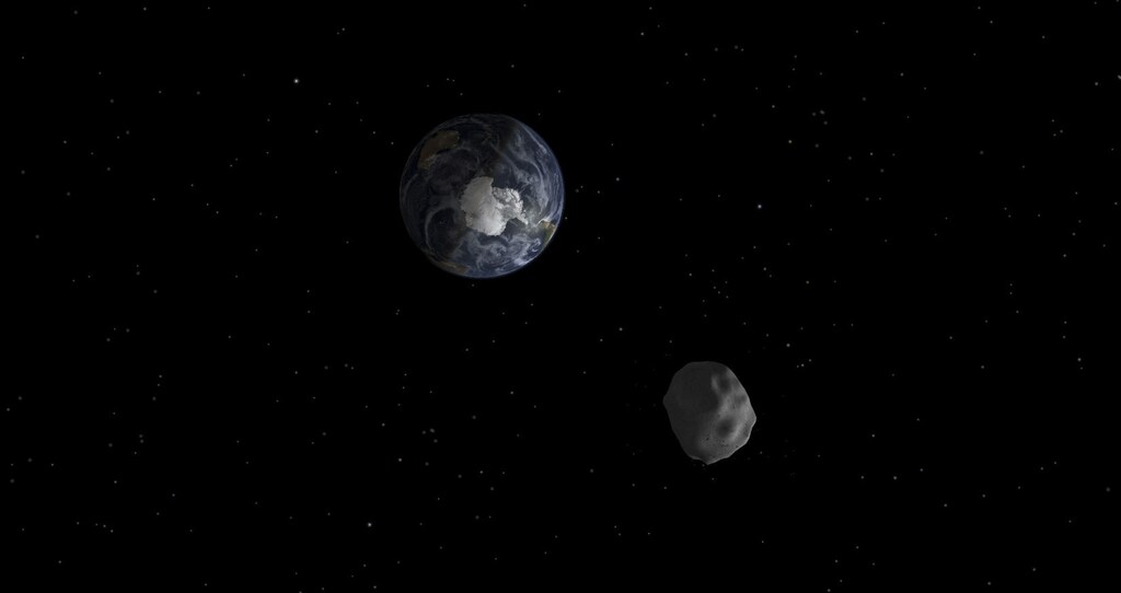 The passage of asteroid 2012 DA14 through the Earth-moon system, is depicted in this handout image from NASA. On February 15, 2013, an asteroid, 150 feet (45 meters) in diameter will pass close, but safely, by Earth. The flyby creates a unique opportunity for researchers to observe and learn more about asteroids.