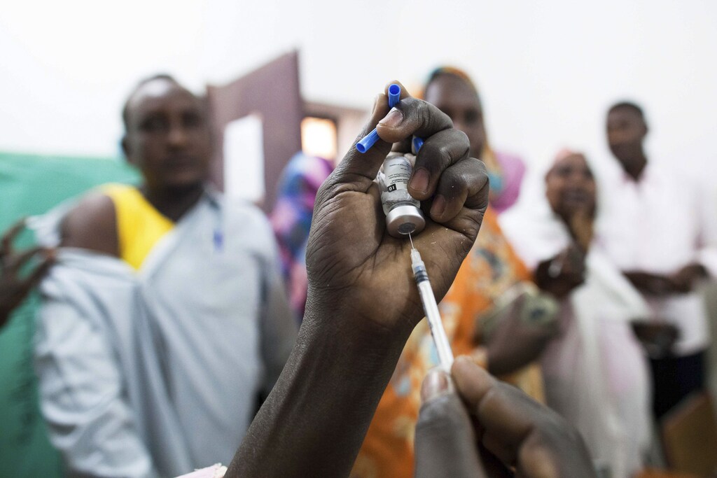 Staff members of Teaching Hospital receive the first vaccination treatment for yellow fever in El Geneina, West Darfur in this November 14, 2012 handout.