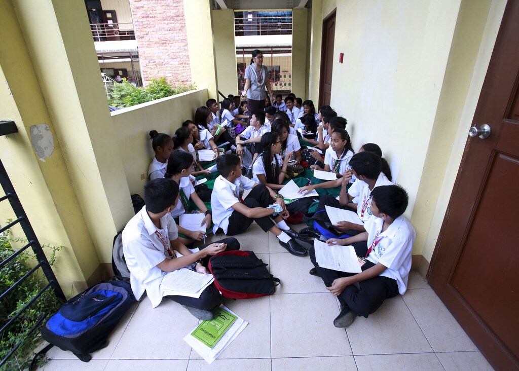 Grade 9 students in a hallway of Timoteo Paez High School in metro Manila, Philippines, September 2015.