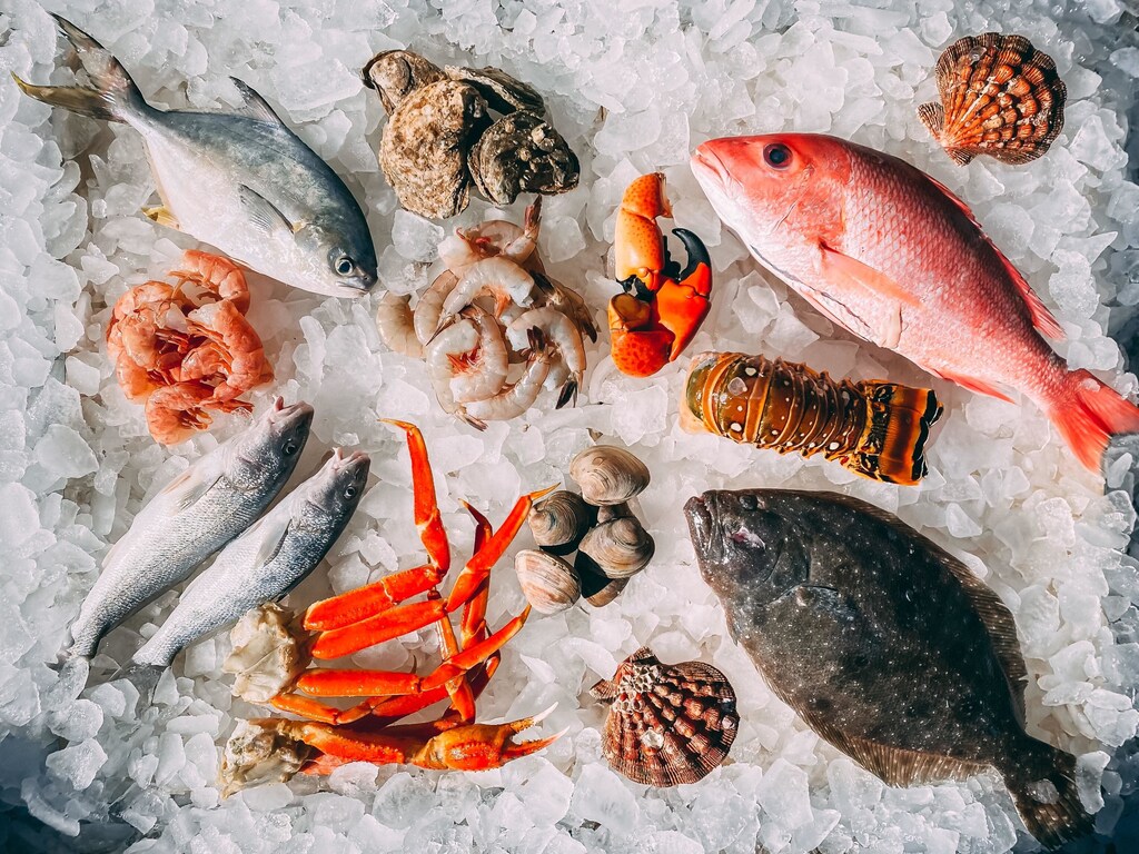 fish, like these dead ones being sold on ice here, are classed as 'blue foods' and could help meet both the challenges of climate change and food security