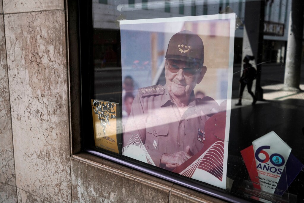 A picture of former Cuban President Raul Castro is displayed in the window of a state building in Havana, Cuba, April 11, 2021. Picture taken April 11, 2021. REUTERS/Alexandre Meneghini - RC26VM9QWV9Y