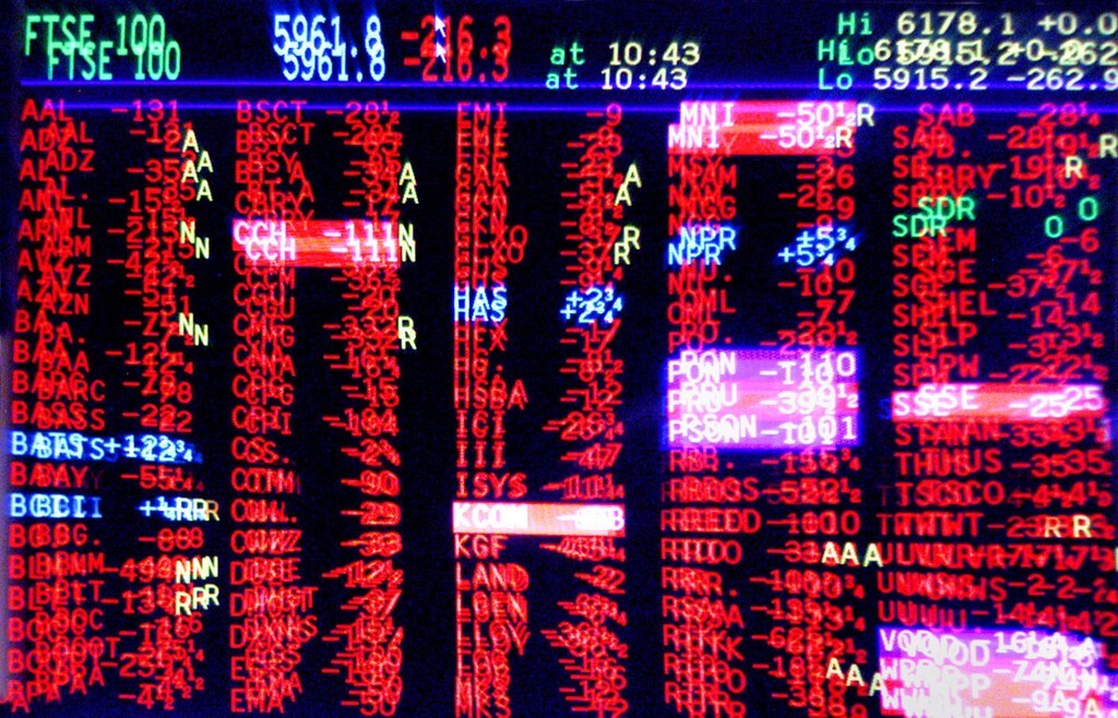 A trading screen at Natwest Stockbrokers shows share prices predominantly in red, indicating a fall in values.