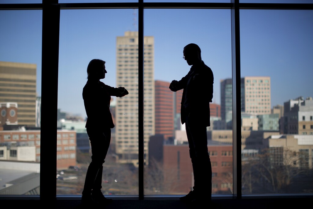 Rosalind Picard, MIT professor and chief scientist at Empatica, and Matteo Lai (R), CEO of Empatica, wear the company's Embrace devices while talking at the Massachusetts Institute of Technology in Cambridge, Massachusetts November 25, 2015. A new wave of wearable computing devices that detect and monitor serious diseases is moving from the laboratory to the market, potentially transforming the treatment of conditions ranging from epilepsy to diabetes and creating business opportunities estimated to be worth tens of billions of dollars. Cambridge, Massachusetts-based Empatica, is developing a wristband designed to alert epilepsy patients and their caregivers of seizures in the hope of averting a dangerous post-seizure condition that can cause sudden, unexpected death. Empatica founder Picard, a Massachusetts Institute of Technology professor and inventor, told Reuters the company has just started large clinical trials using its wristband device on individuals with depression. Picture taken November 25, 2015. To match Insight HEALTH-WEARABLES/FDA REUTERS/Brian Snyder - RTX1Z79Q