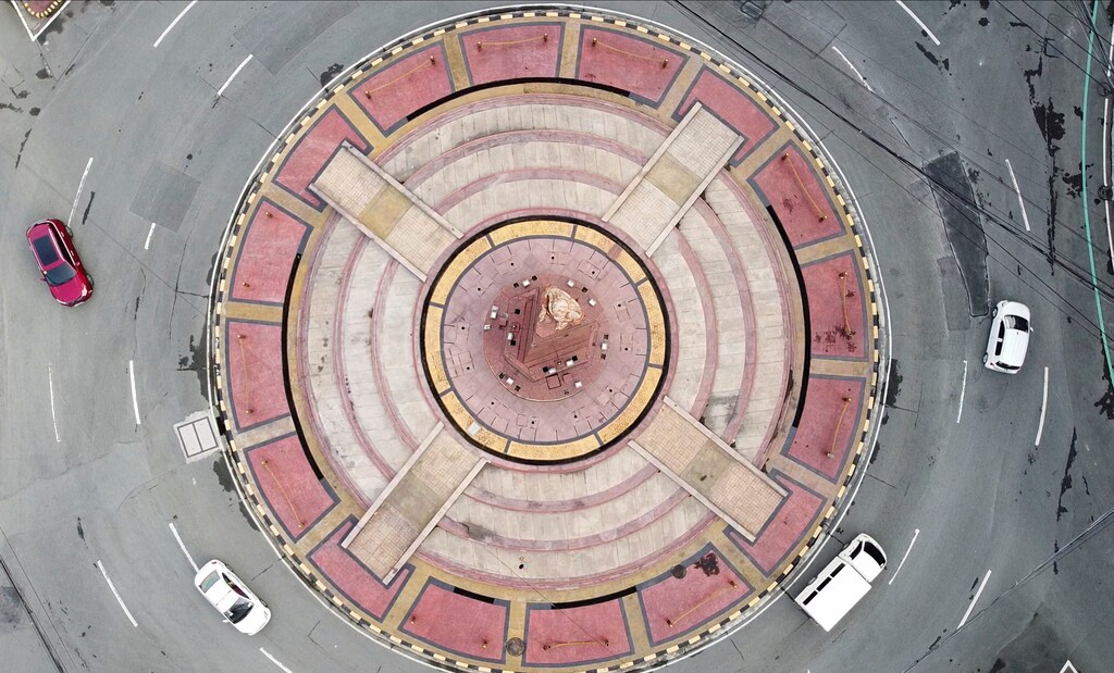 An aerial view shows minimal traffic in a roundabout in Quezon City, during a two-week lockdown following a surge in coronavirus disease (COVID-19) cases, in Metro Manila, Philippines August 9, 2021. Picture taken with a drone. REUTERS/Adrian Portugal - RC2G1P9OLD11