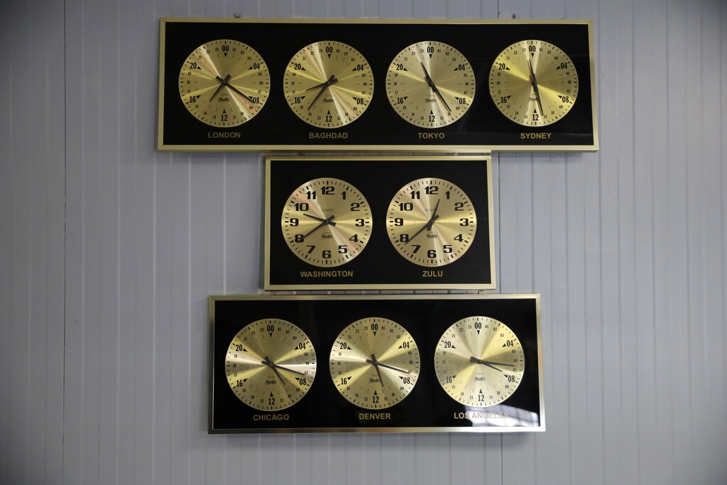 Clocks showing time in different capitals of the world hang at the U.S. Naval Base in Guantanamo Bay, Cuba, June 3, 2017. REUTERS/Carlos Barria SEARCH "GUANTANAMO COMBO" FOR THIS STORY. SEARCH "WIDER IMAGE" FOR ALL STORIES. - RC1C30DBC9D0