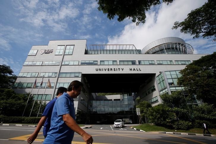 A man passes the university hall at the National University of Singapore July 27, 2016. REUTERS/Edgar Su AUNI
