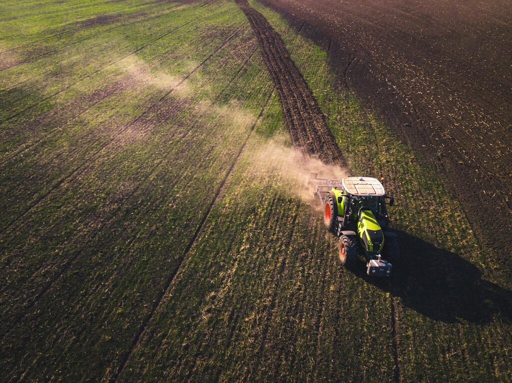Autonomous farming : Tractor in a field.