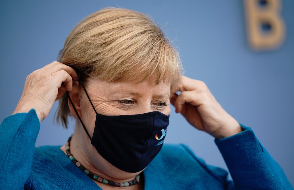 German Chancellor Angela Merkel wears a mask as she leaves her annual summer news conference during the outbreak of the coronavirus disease (COVID-19) in Berlin, Germany, August 28, 2020. Michael Kappeler/Pool via REUTERS - RC2ZMI9CHMUB