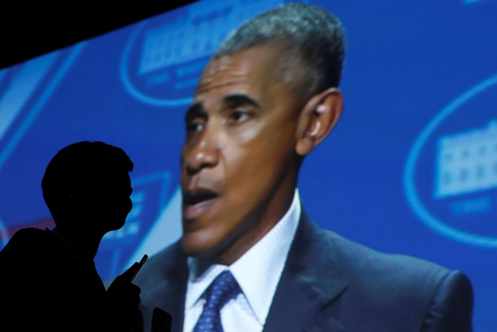 A woman listens as U.S. President Barack Obama delivers remarks at United State of Women summit in Washington, U.S., June 14, 2016. REUTERS/Carlos Barria - RTX2G921