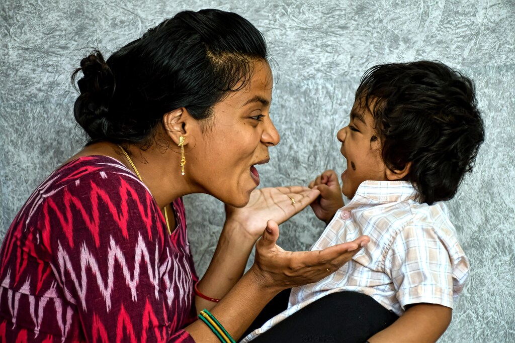 A mother plays with her child