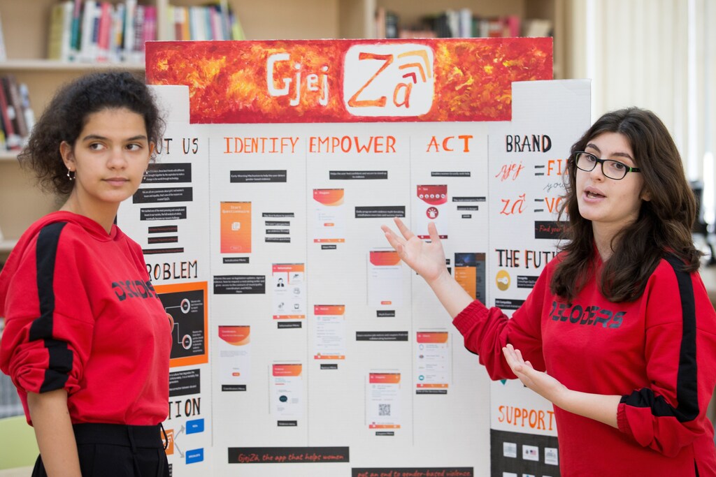 Dea Rrozhani and Jonada Shukarasi, both 16, creators of "GjejZa", an application that's intended to fight domestic violence, speak during a presentation in Tirana, Albania September 27, 2019. Picture taken September 27, 2019. REUTERS/Florion Goga - RC1B1108EAB0
