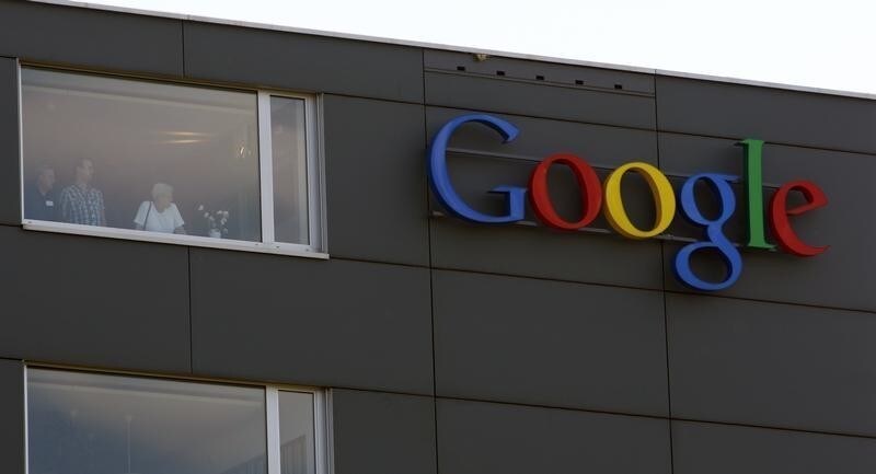 A company logo is placed on the roof of the Google building in Zurich May 25, 2010. This logo has been updated and is no longer in use. REUTERS/Arnd Wiegmann (SWITZERLAND - Tags: BUSINESS SCI TECH) - BM2E65P18NX01