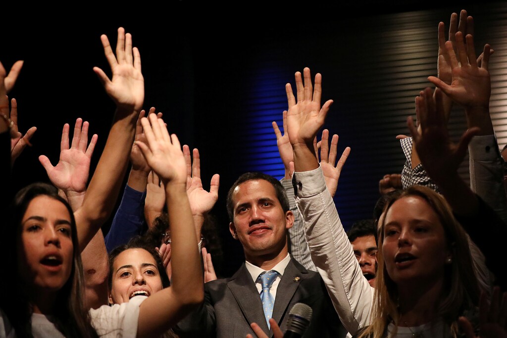 Venezuelan opposition leader Juan Guaido, who many nations have recognized as the country's rightful interim ruler, is seen with students in Caracas, Venezuela February 11, 2019. REUTERS/Andres Martinez Casares - RC1A70BEC4F0